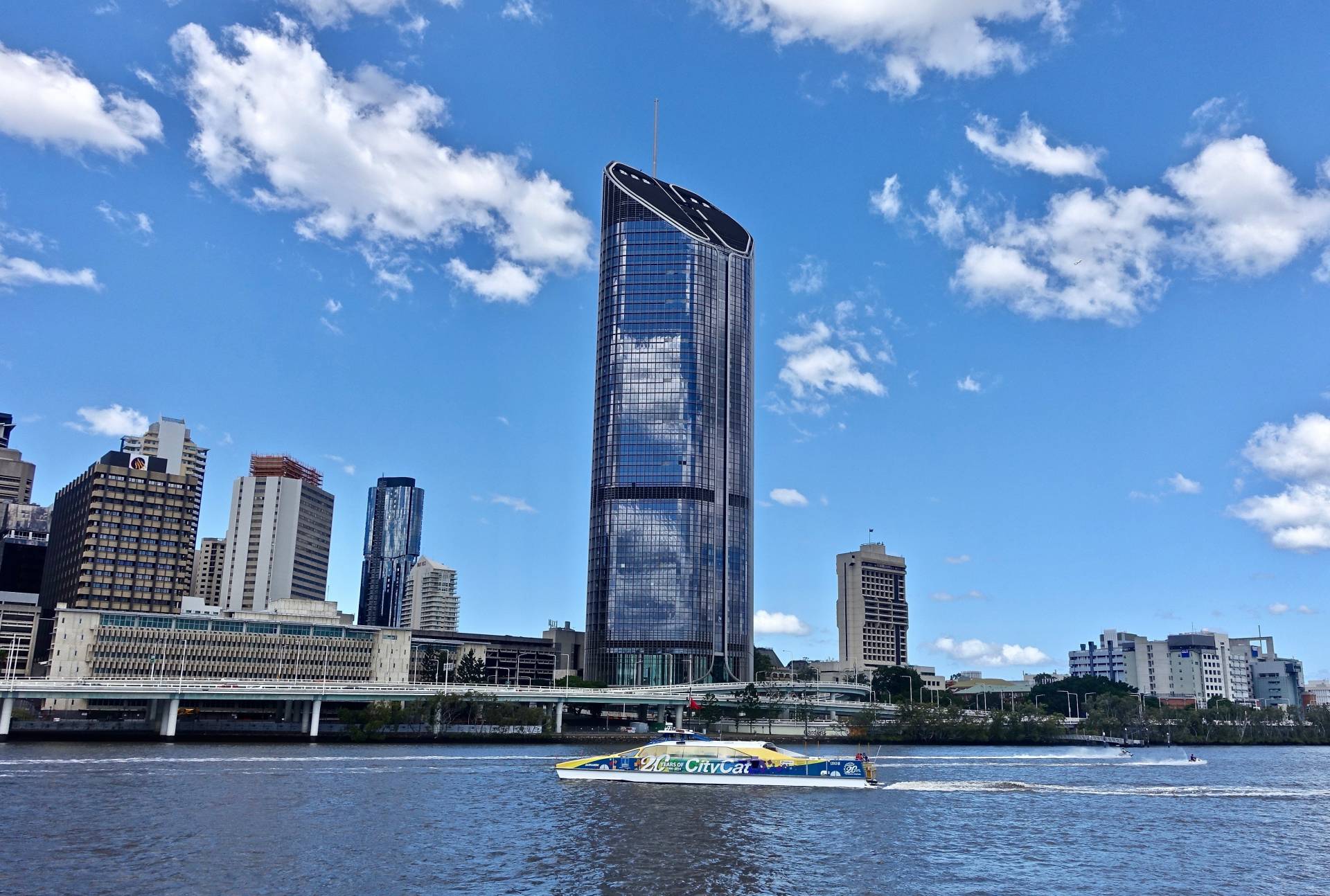 Image shows Brisbane city skyline with Brisbane River in front